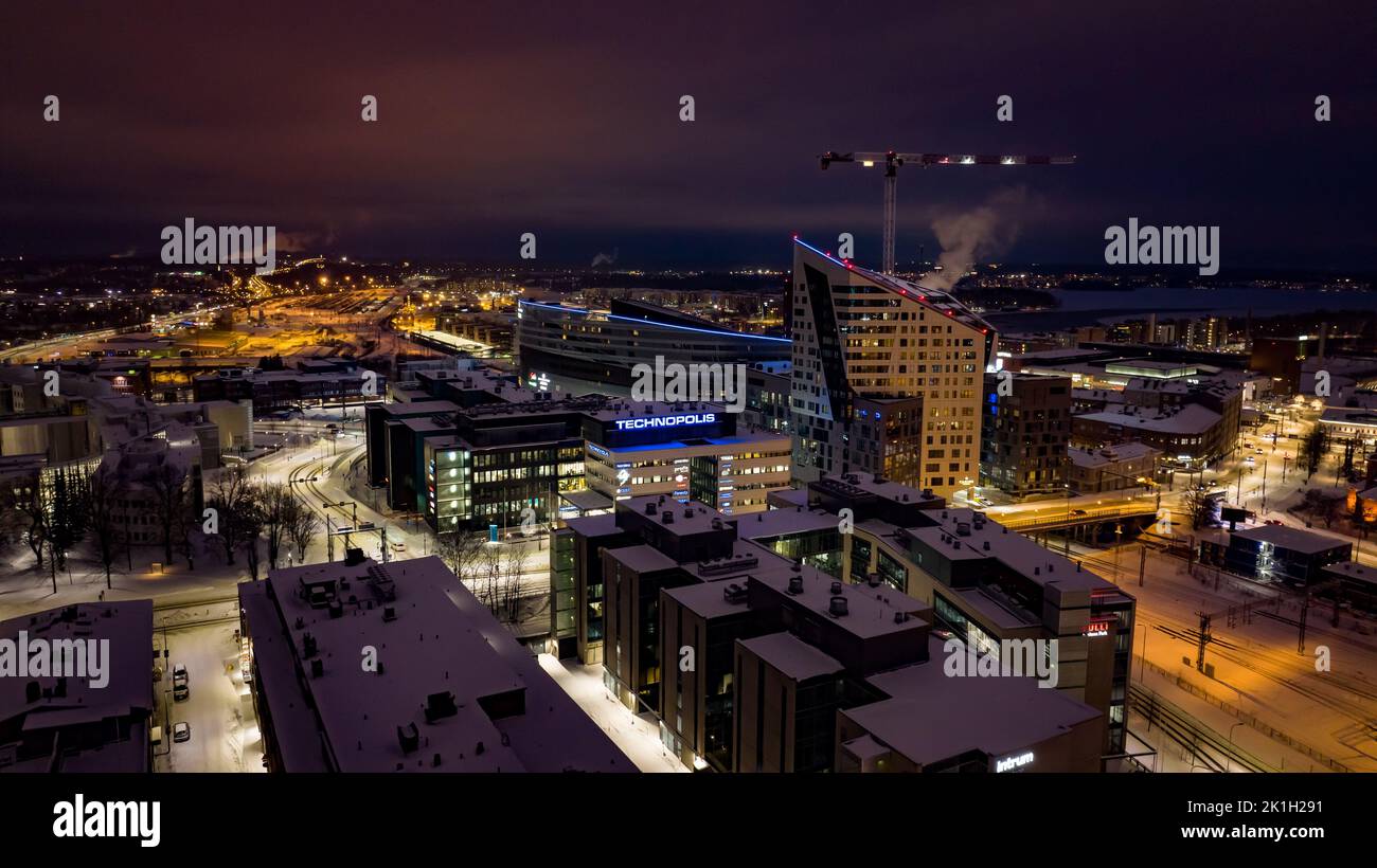 Aerial view of the Illuminated Technopolis building in Tampere, winter evening in Finland Stock Photo