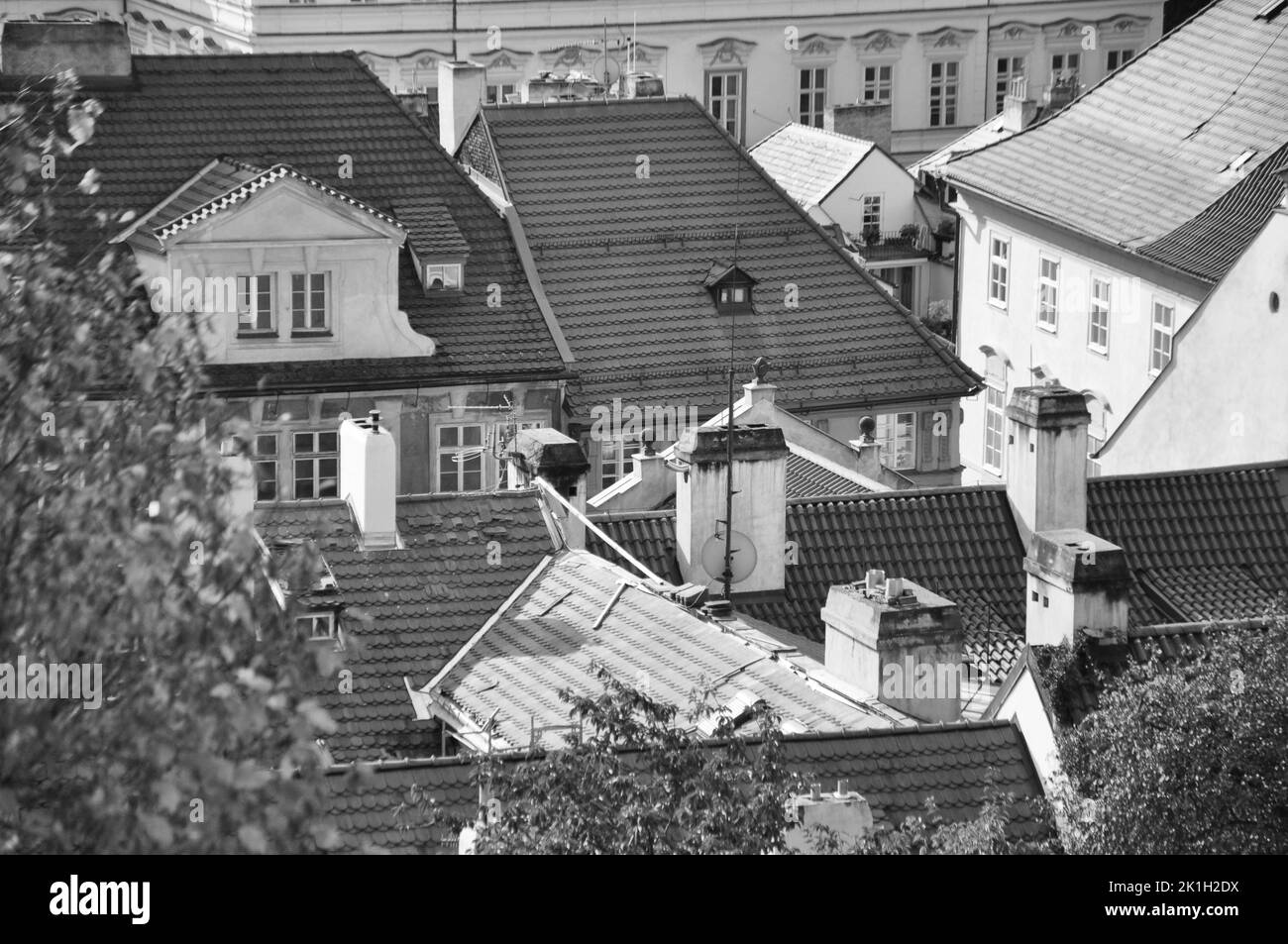 a grayscale of the roofs of Prague Old Town in Prague, Czech Republic Stock Photo