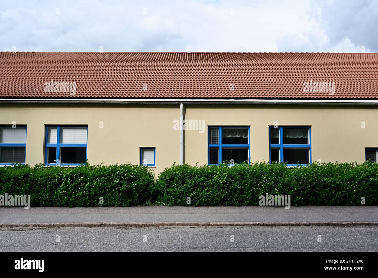 front view of a building with a tiled roof, deadpan photography Stock Photo