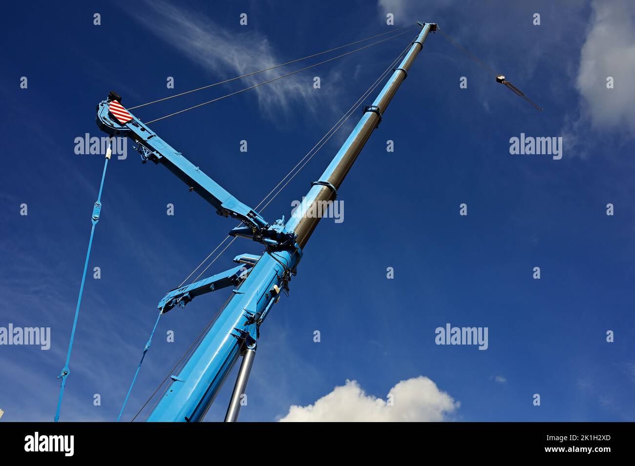 boom lift crane against the blue sky Stock Photo