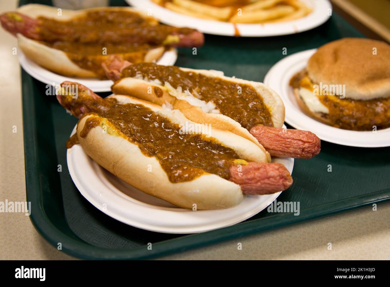Fast food American style, hamburger, hot dogs, and French fries on a tray. Stock Photo