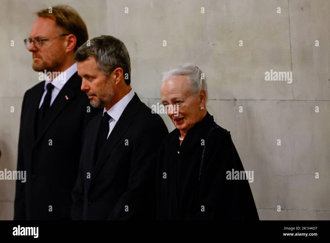 Denmark's Queen Margrethe and Crown Prince Frederik view the coffin of
