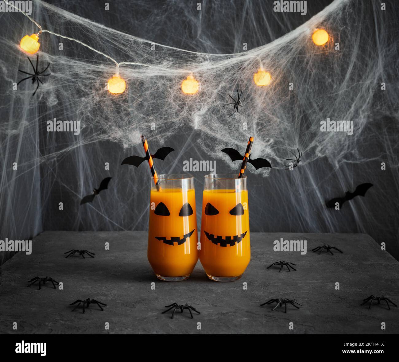 Halloween Pumpkin Or Carrot Drink In Glasses With Jack O Lantern Face Halloween Pumpkin Or Carrot Drink In Glasses With Jack O Lantern Face