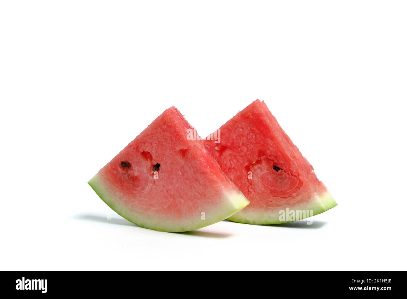 Two slices ripe red watermelon white background Stock Photo - Alamy