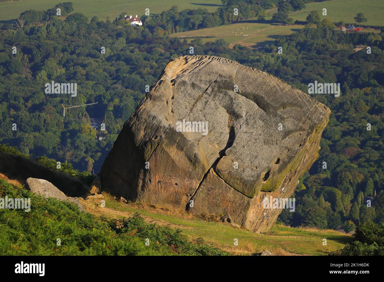 The smaller rock on Ilkley Moor known as the Calf Stock Photo - Alamy