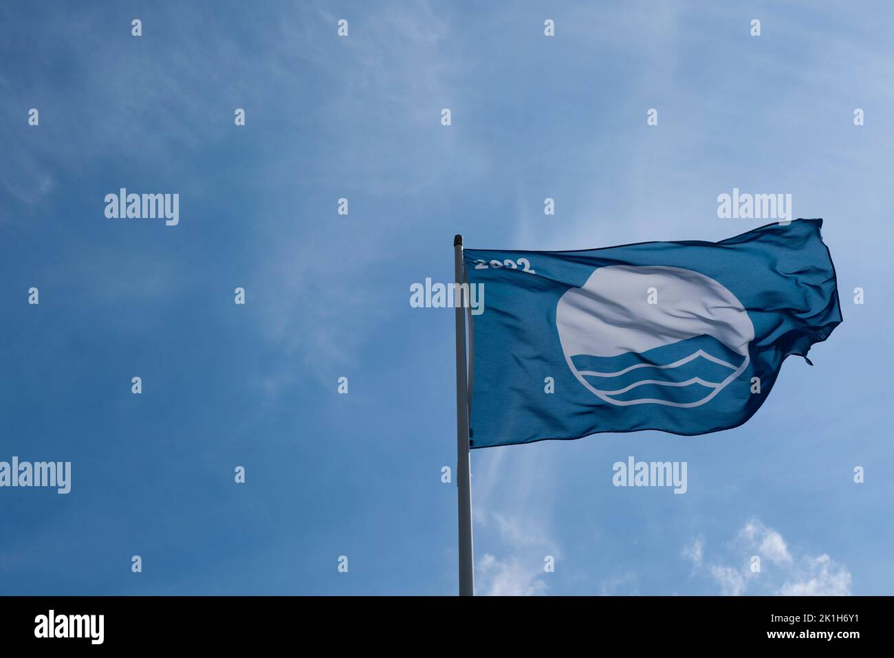A Blue Flag, a certification by the Foundation for Environmental Education, at Coppet Hall Beach in Saundersfoot, Pembrokeshire, Wales. Stock Photo