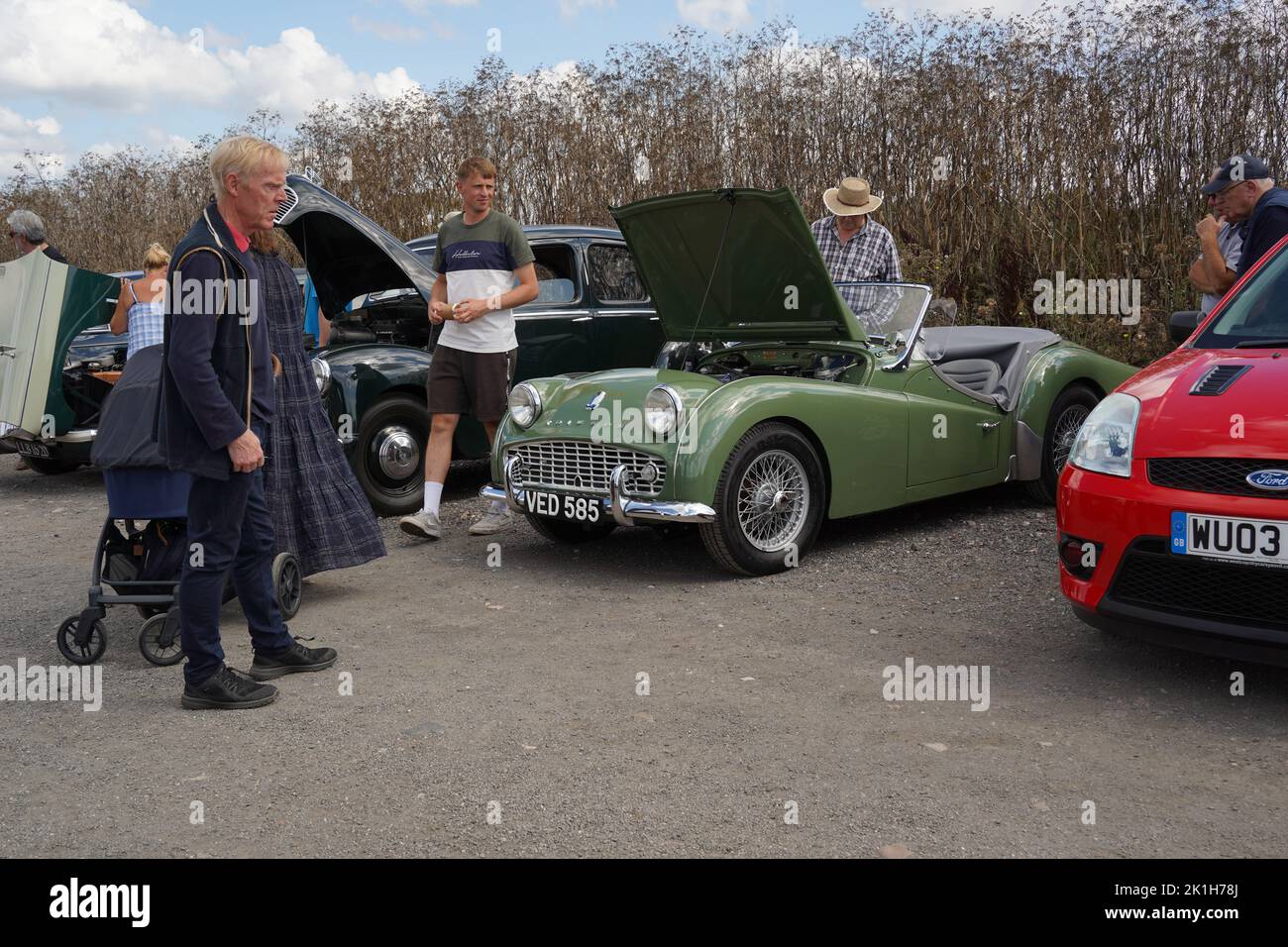 Exeter, UKAugust 2022 Caucasian men visiting a classic car show at