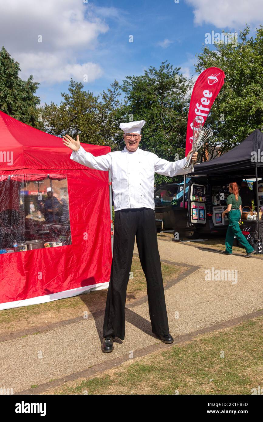Entertainer chef on stilts at Feast Hinckley Food & Drink Festival, Argents Mead, Hinckley, Leicestershire, England, United Kingdom Stock Photo