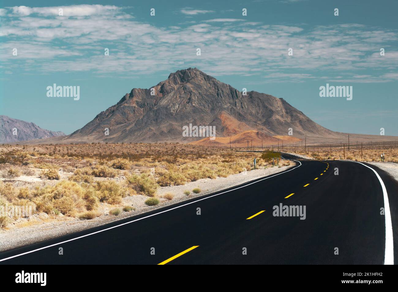 Highway 127 in the Mojave Desert near Death Valley, looking north, showing Eagle Mountain in the background. Stock Photo