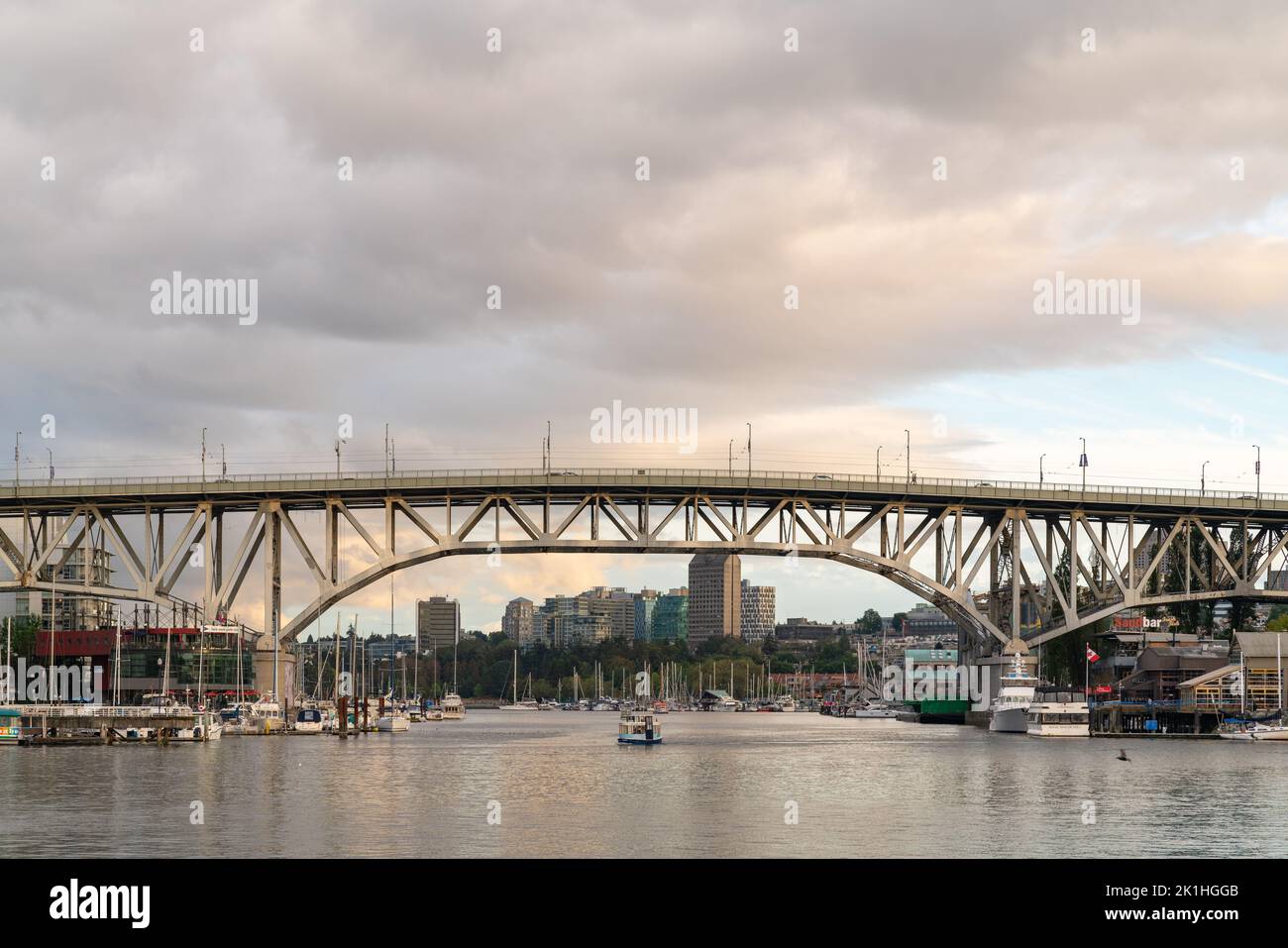 Granville Ferry traveling under the Burrard Bridge in Vancouver, Canada. Stock Photo