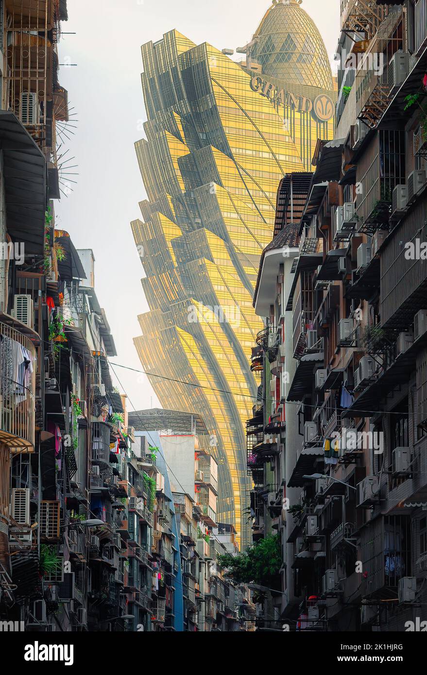 A vertical shot of grand Lisboa Macau architecture from the slums in Macau city, China Stock Photo