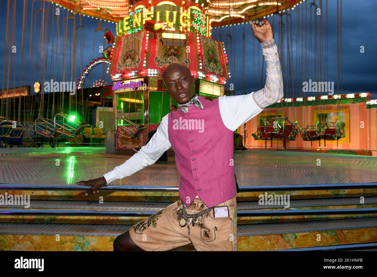 Munich, Germany. 18th Sep, 2022. Model Papis Loveday celebrates on the way to the 'Almauftrieb' in the Käfer tent at the Oktoberfest. The 'Almauftrieb' is a fixed event in the Wiesn calendar and takes place on the first Sunday of the Oktoberfest season in the Käfer tent. Credit: Felix Hörhager/dpa/Alamy Live News Stock Photo