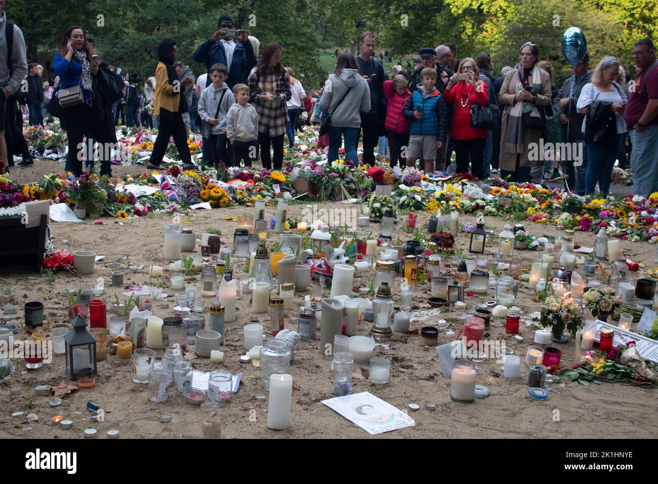 Candles, messages, cards and floral tributes in Green Park after the