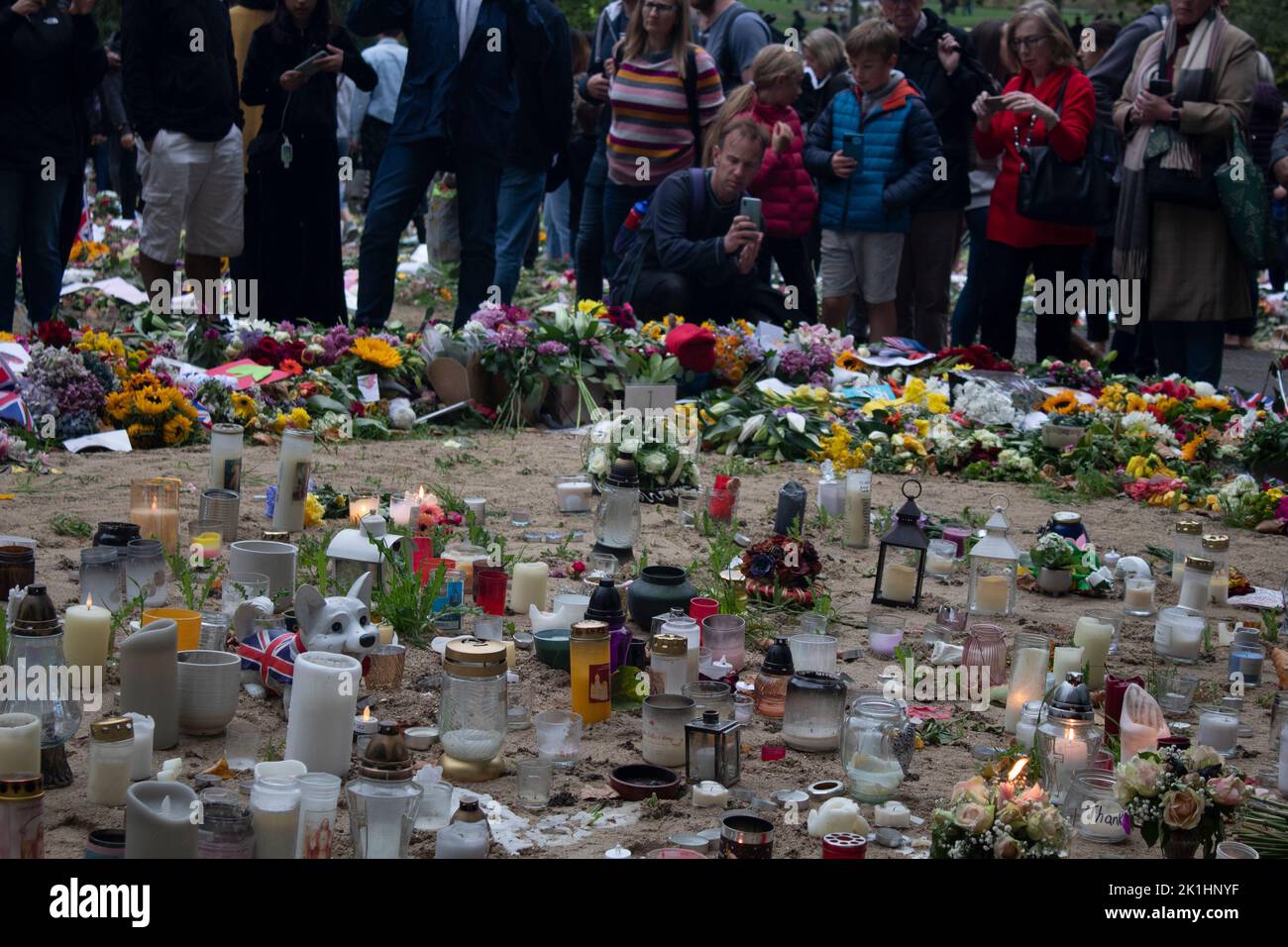 Candles, messages, cards and floral tributes in Green Park after the