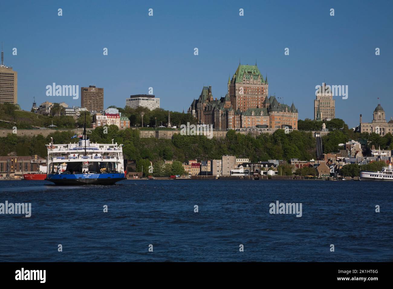 Lomer Gouin ferry boat crossing Saint-Lawrence river and Old Quebec City skyline, Quebec, Canada Stock Photo
