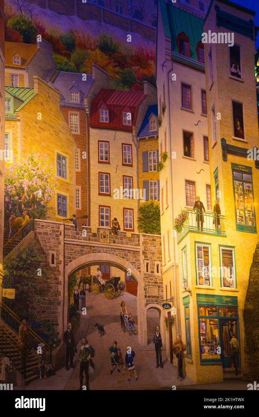 La Fresque des Quebecois mural at night, Maison Soumande, rue Notre-Dame, Old Quebec City, Quebec, Canada. Stock Photo