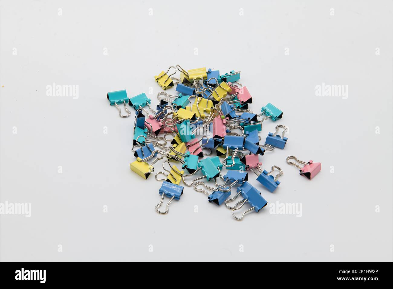 Pile of crocodile clips on a white background Stock Photo