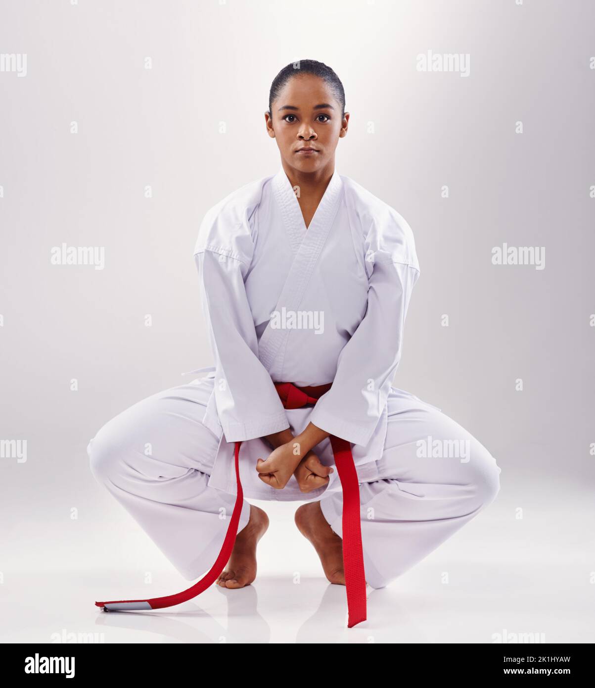Shes ready for her next fight. a young woman doing karate. Stock Photo