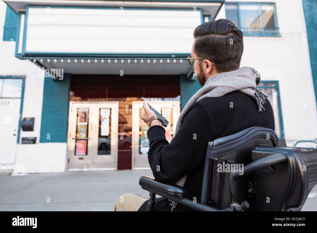 On the phone in a movie theater hires stock photography and images Alamy