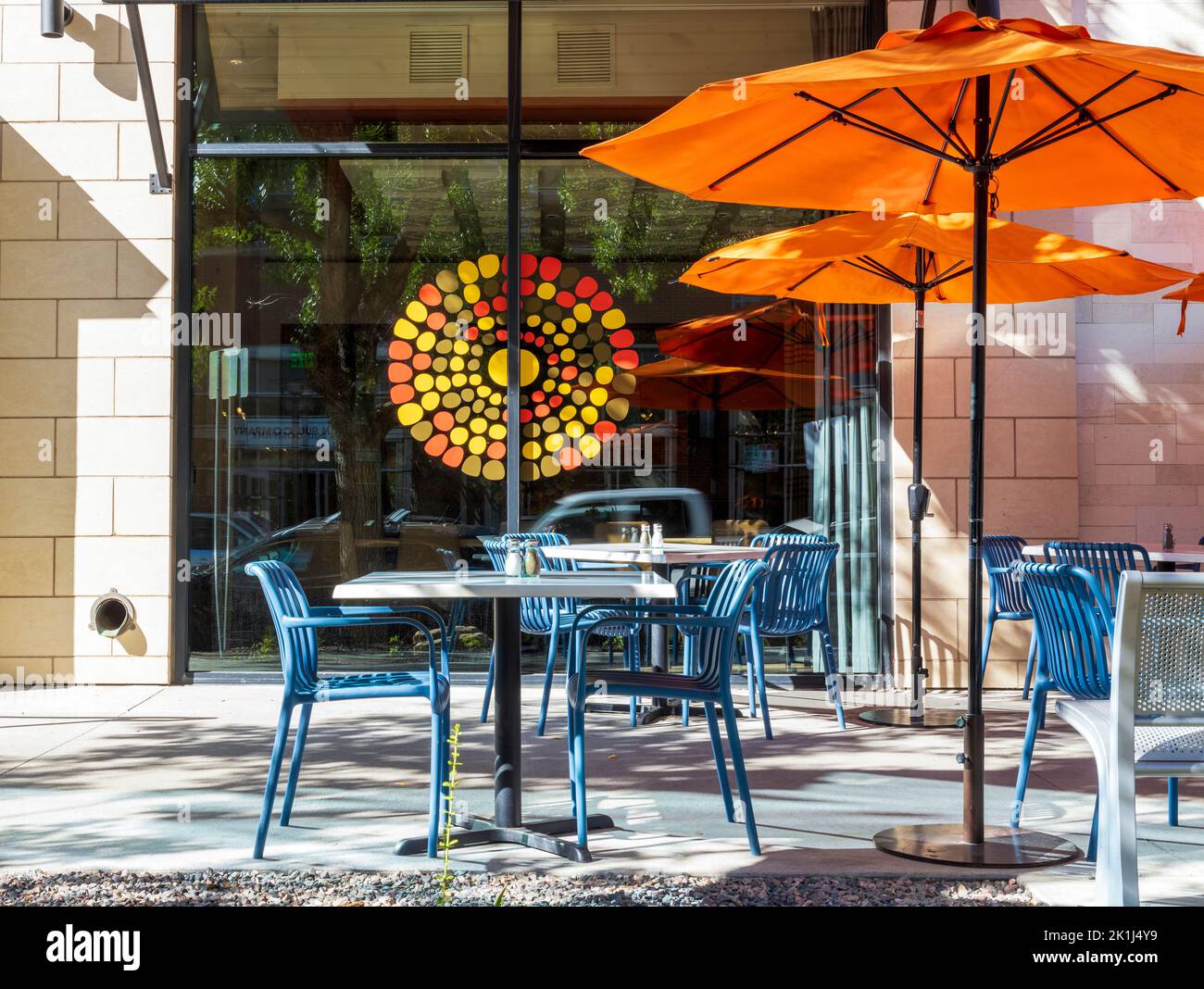 Empty cafe with tables and chairs. The street exterior of a restaurant