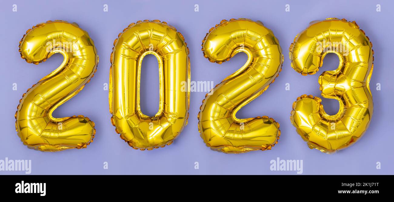 Happy New year 2023 celebration. Foil balloons numeral 2023 .Flat lay Stock Photo