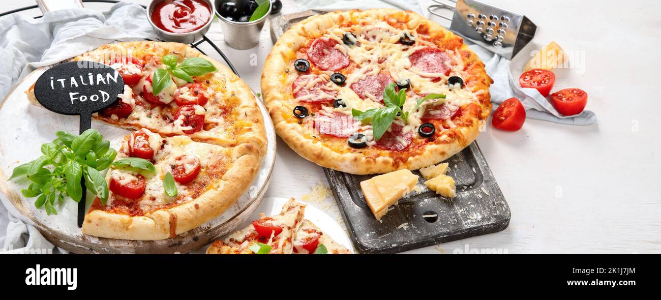 Freshly baked pizza on dark background. Tasty homemade food concept. panorama Stock Photo