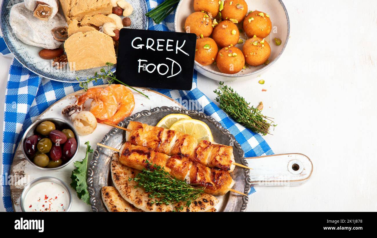 Greek cuisine dishes on neutral background. Traditional food concept. Top view, copy space Stock Photo