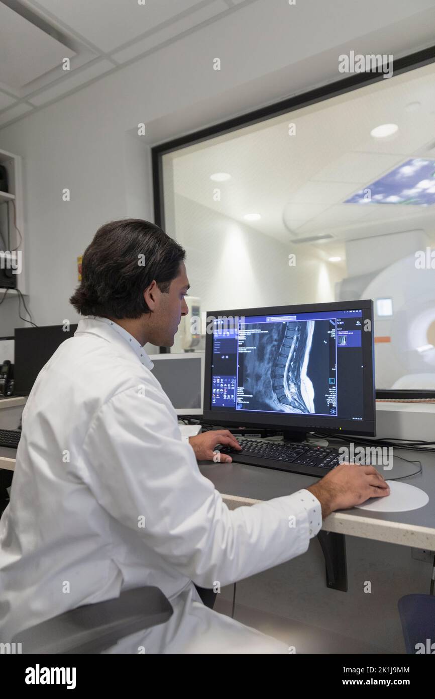 Radiology technologist in MRI computer room Stock Photo Alamy