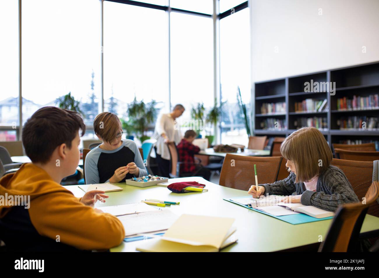 Junior high students studying in library study hall Stock Photo Alamy
