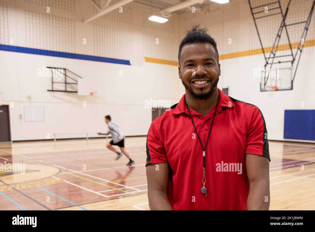 Portrait confident male basketball coach in gymnasium Stock Photo Alamy