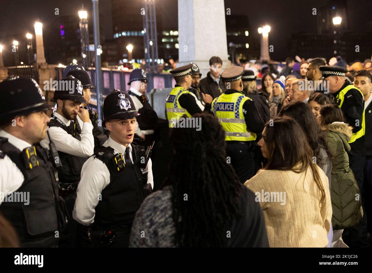 People argue with police officers after the door to pay respect to Britain's Queen Elizabeth was closed, following her death, outside of the Houses of Parliament in London, Britain September 18, 2022. REUTERS/Carlos Barria Stock Photo
