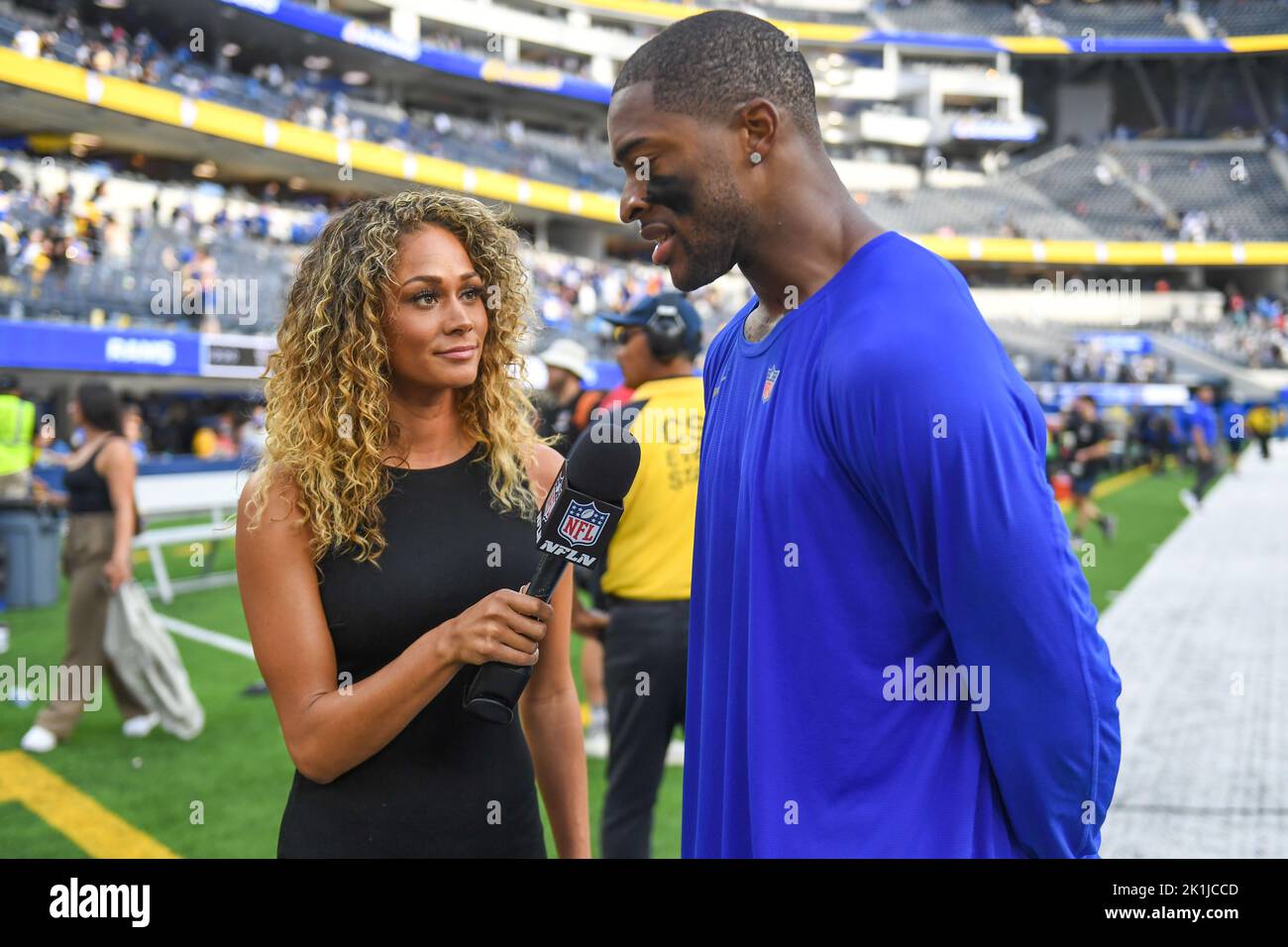 NFL Network reporter Kayla Burton, left, interviews Dallas Cowboys