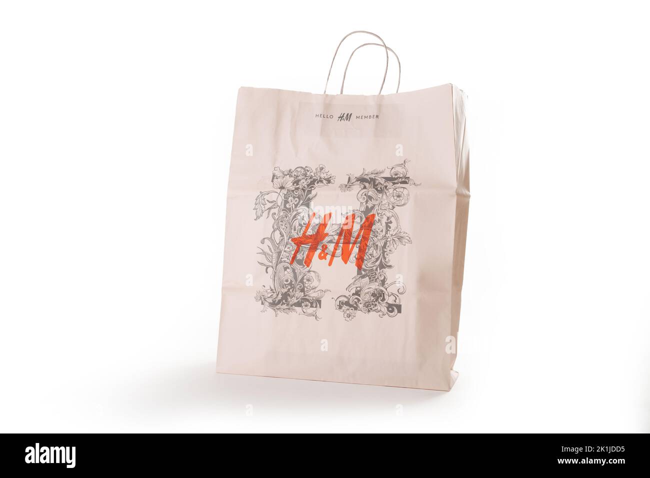 Cyprus, Paphos - SEPTEMBER 08, 2022: Patterned HM paper bag from famous swedish fast-fashion clothing brand. Over white background. Stock Photo