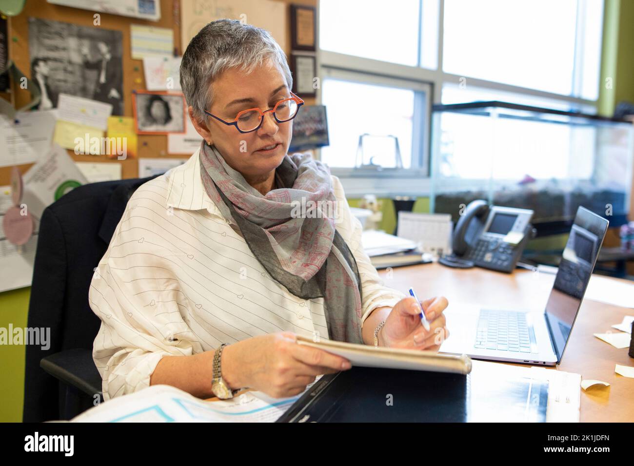 Senior female junior high teacher planning in classroom Stock Photo Alamy