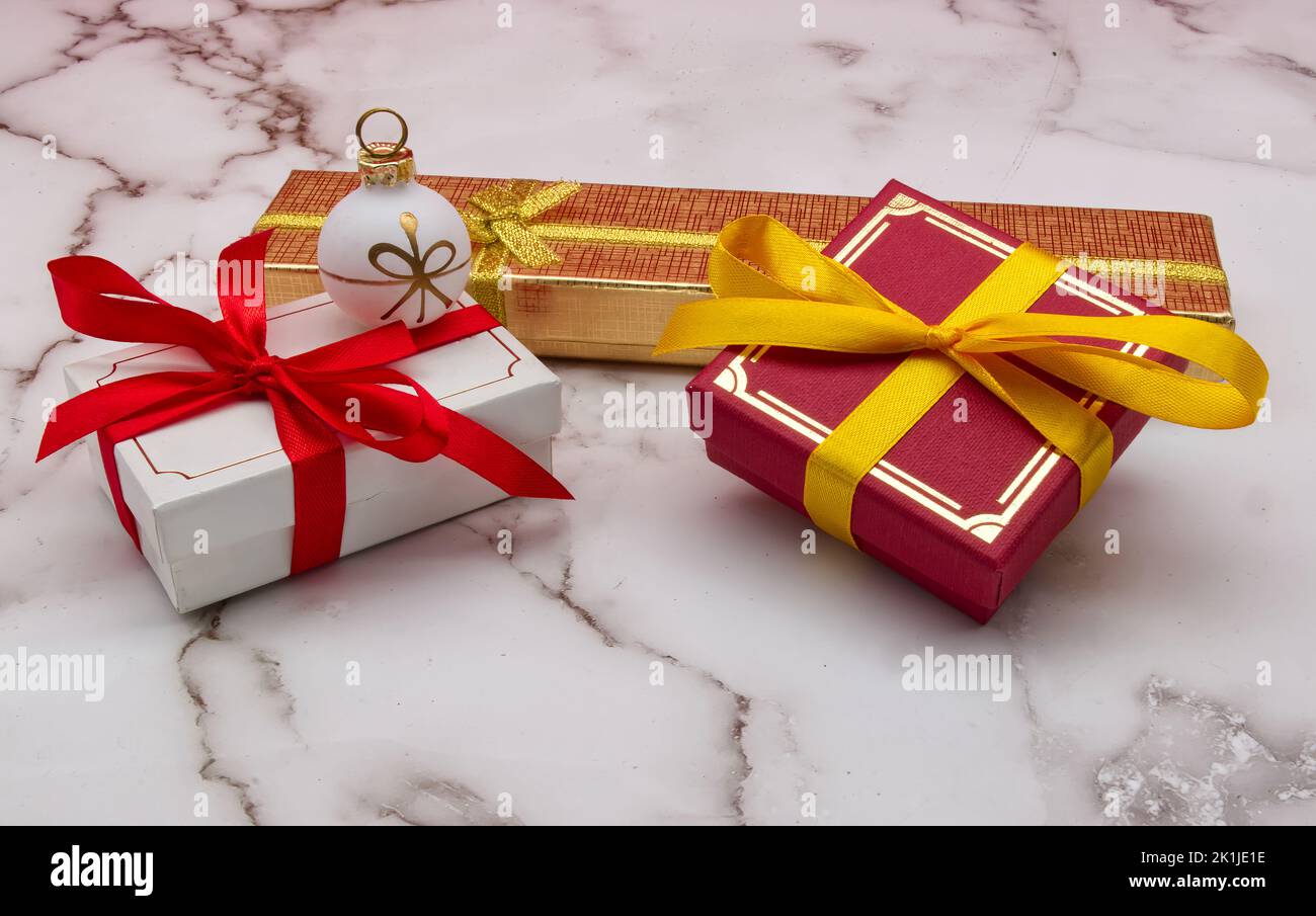 Christmas gift boxes isolated on marble table. Christmas decorations. Stock Photo