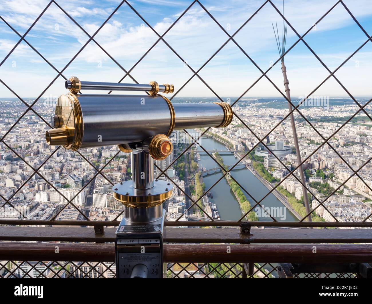 Paris, France - 18 April 2022: One of the coin-operated vintage telescopes at the observation platform on top of Eiffel tower. Stock Photo