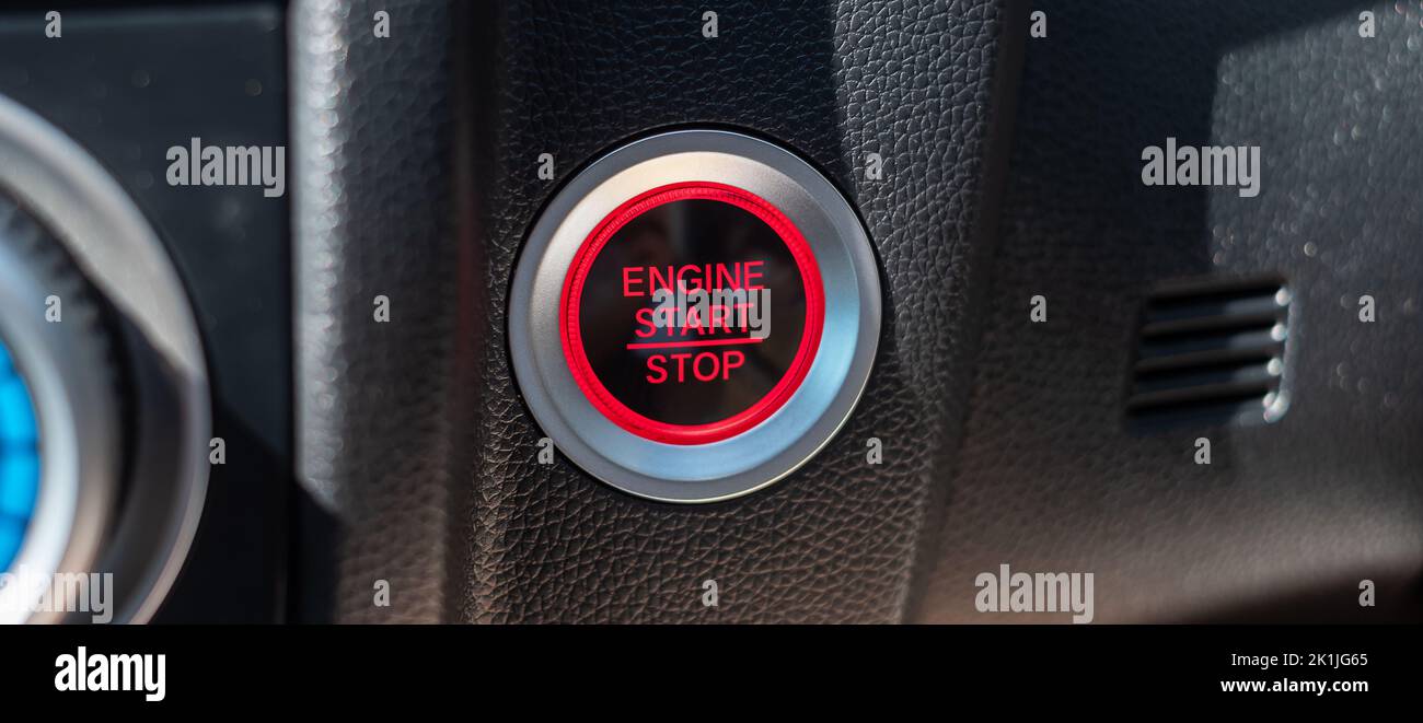 a car ignition button or START engine inside modern electric automobile