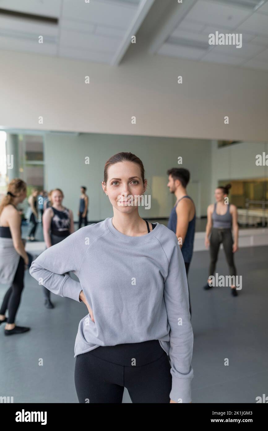 Portrait confident female dance instructor in dance studio Stock Photo