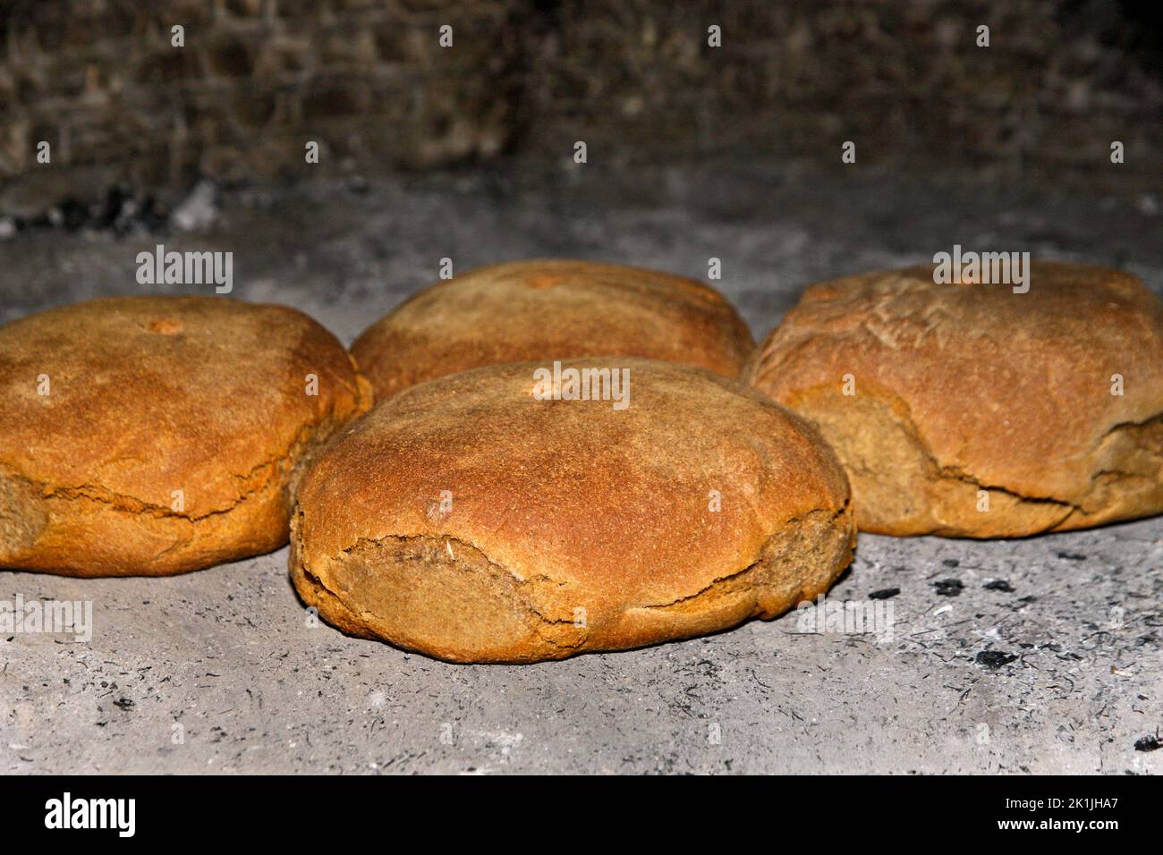 Freshly baked round loafs of bread, a traditional form of making bread in Greece, Europe, especially in provincial places. Stock Photo