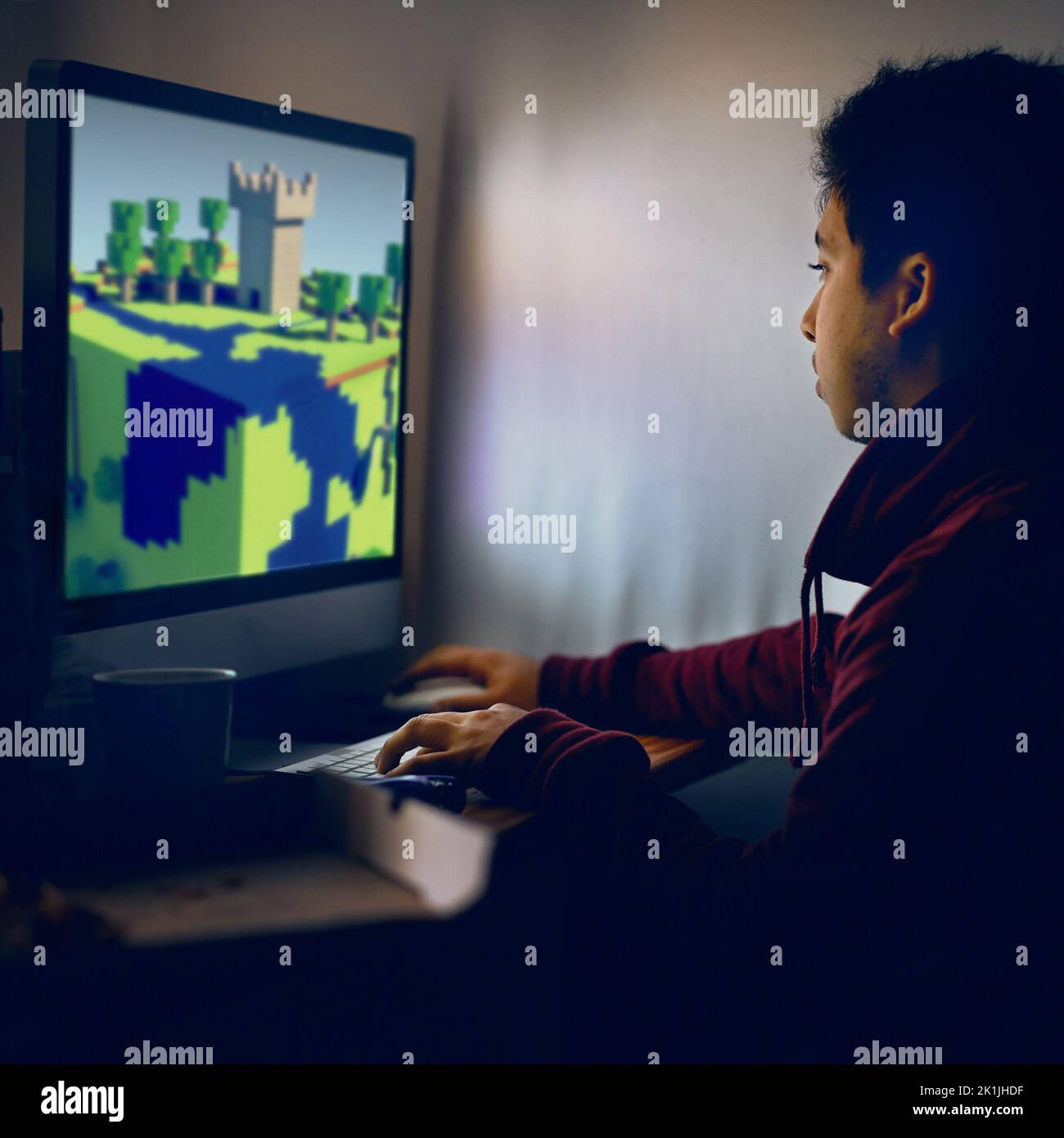 Powering up defenses. a young gamer focused on his game. ALL design on ...