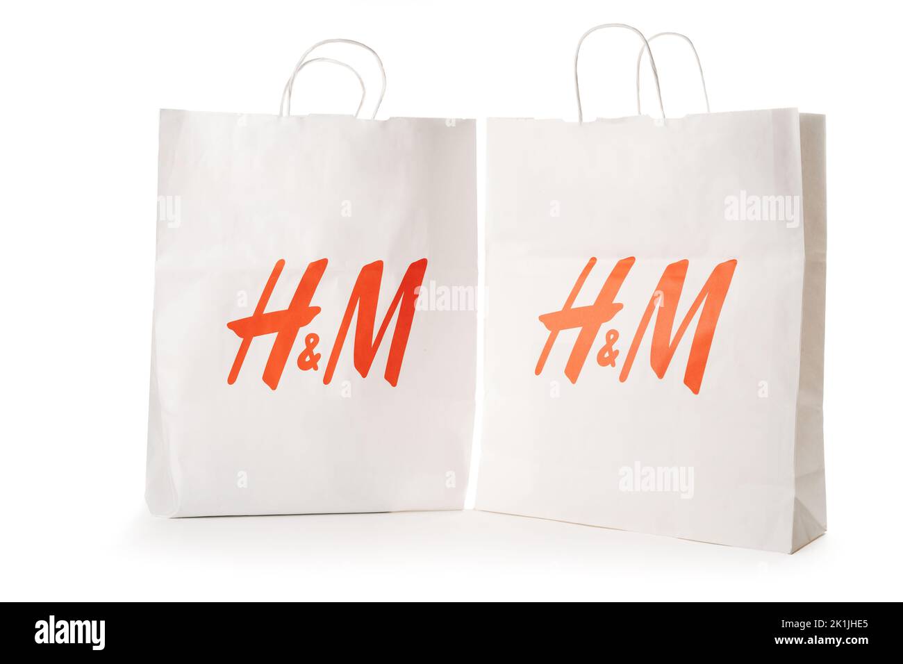 Cyprus, Paphos - SEPTEMBER 08, 2022: Two HM paper bag from famous swedish fast-fashion clothing brand. Over white background. Stock Photo