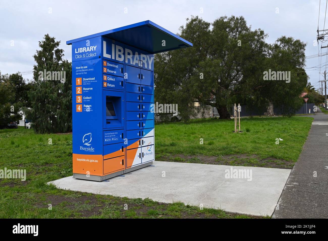 Click and collect library lockers, run by Bayside City Council's library service, beside a footpath at Hurlingham Park Stock Photo