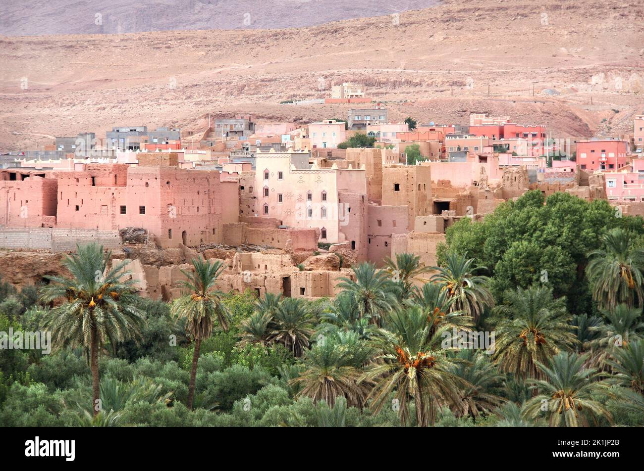 Aerial view of medieval town in Atlas mountains, Morocco, North Africa. Aerial view of old adobe houses and palms. Beautiful moroccan landscape top vi Stock Photo