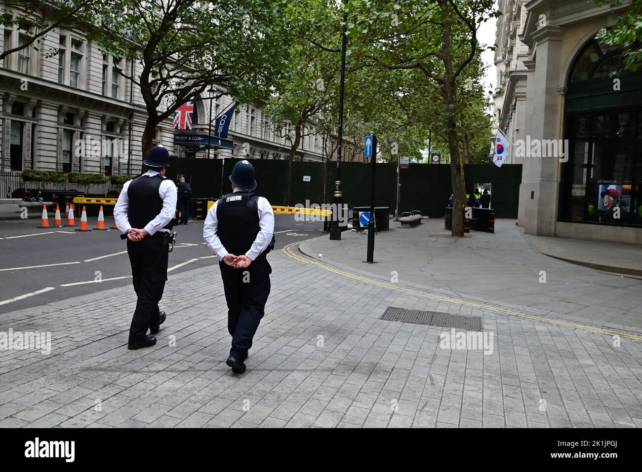 State funeral of Her Majesty Queen Elizabeth II, London, UK, Monday 19th September 2022. Police officers on the beat patrol the perimeter on Northumberland Avenue. Stock Photo