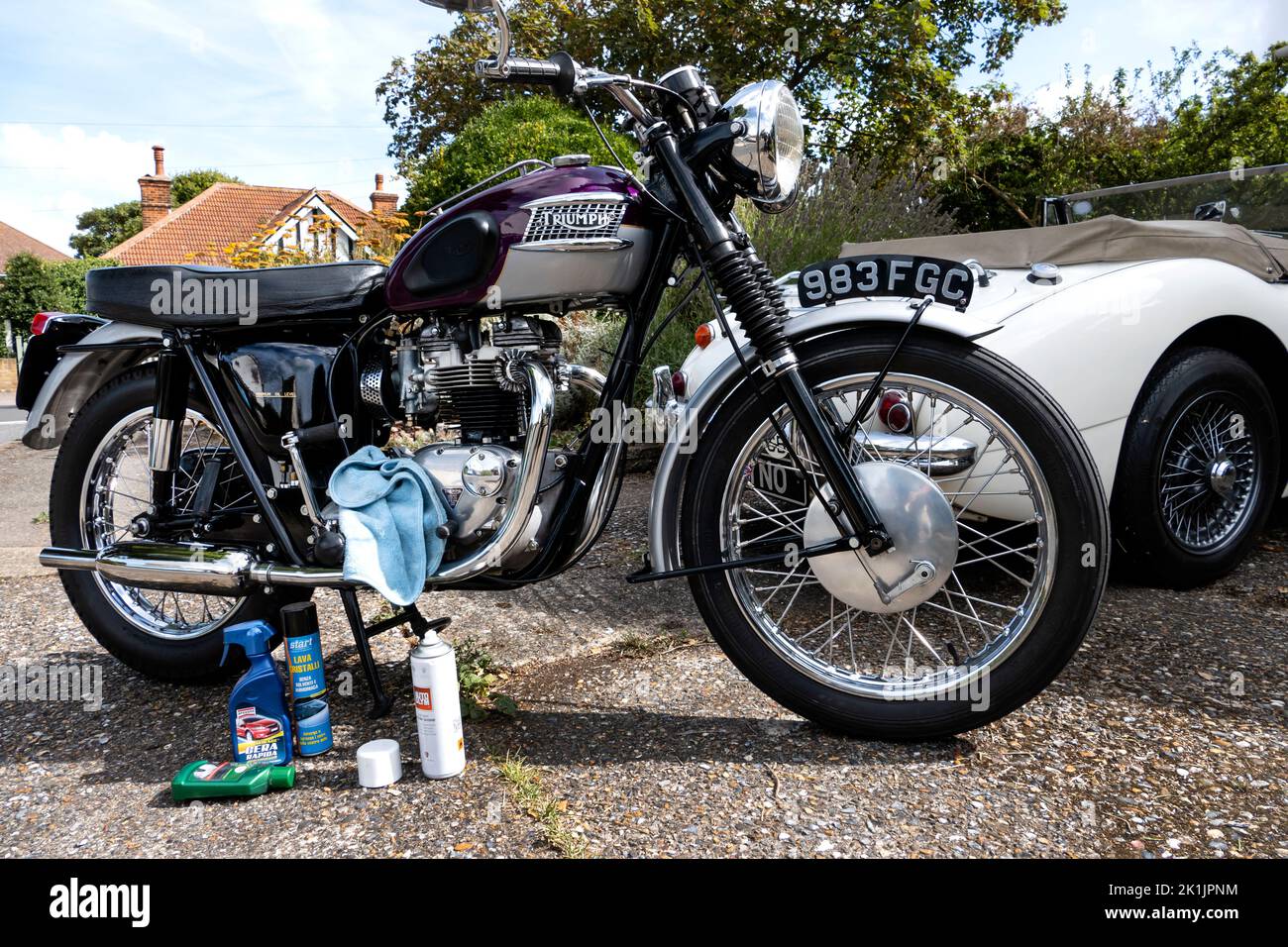 Cleaning a classic 1963 Triumph Trophy TR6 Motorcycle Stock Photo