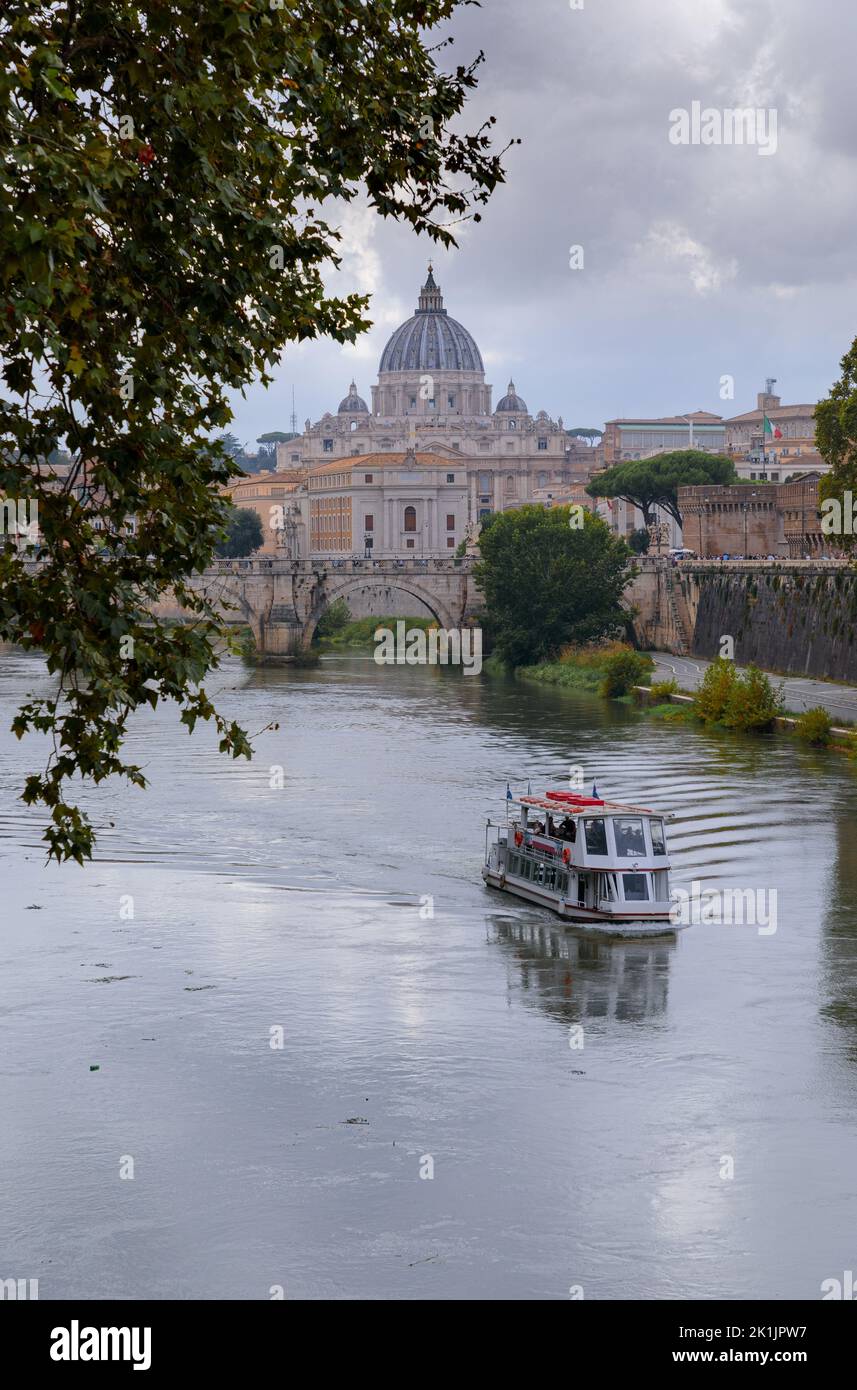 Tiber River in Rome, Italy: view of bridge Sant'Angelo and on background Saint Peter's Basilica. Stock Photo
