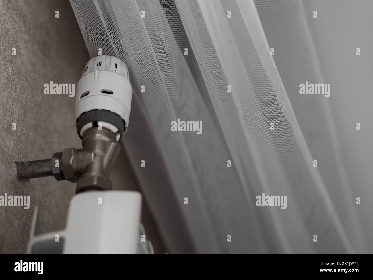heat regulator on the radiator. saving gas and heat in the apartment Stock Photo Alamy