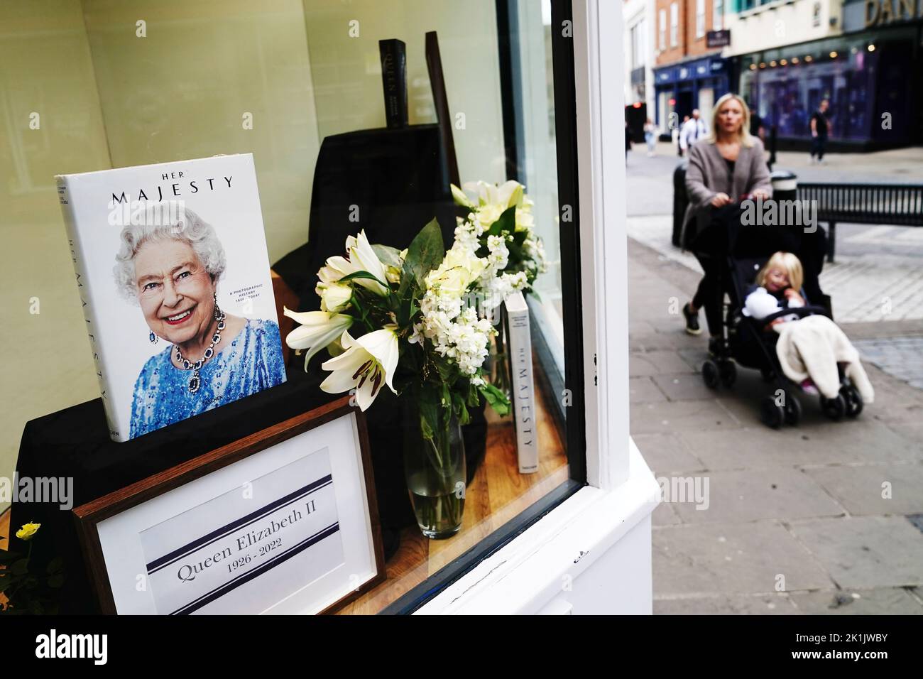 A tribute is seen in a shop window near Windsor Castle ahead of the funeral of Queen Elizabeth II. Picture date: Monday September 19, 2022. Stock Photo