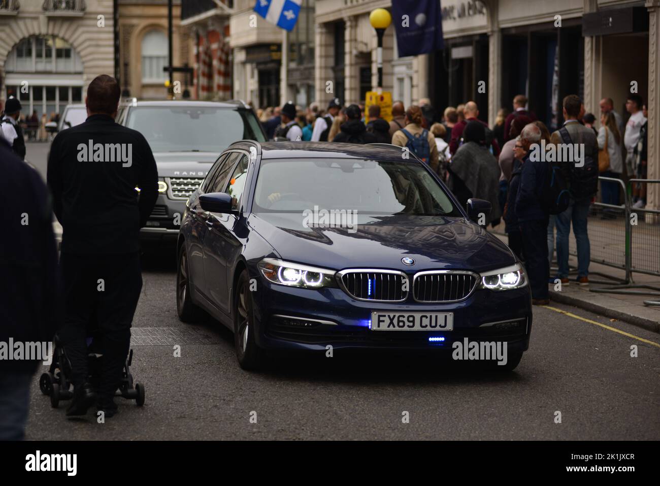 State funeral of Her Majesty Queen Elizabeth II, London, UK, Monday 19th September 2022. VIPs on the move with a police escort through crowds of people. Stock Photo