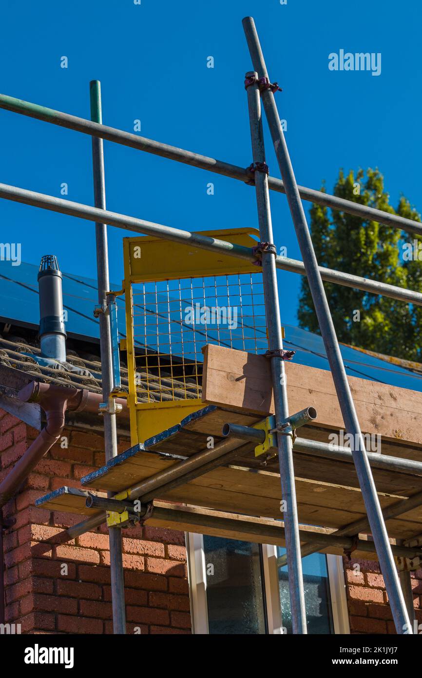 Scaffolding poles on a domestic property Stock Photo Alamy